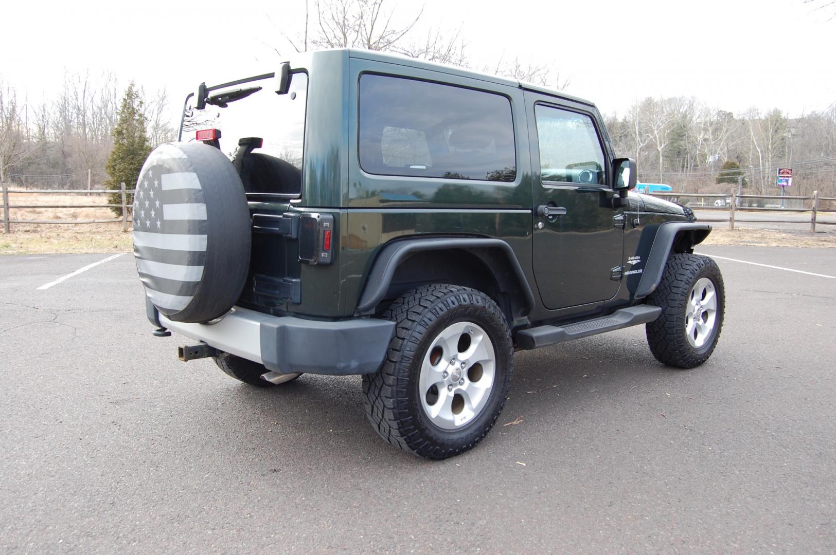 2011 Green /Tan leather Jeep Wrangler Sahara 4WD (1J4AA5D10BL) with an 3.8L V6 OHV 12V engine, 6 Speed Manual transmission, located at 6528 Lower York Road, New Hope, PA, 18938, (215) 862-9555, 40.358707, -74.977882 - Here we have a nice running and driving Jeep Wrangler with a 3.8L V6 putting power to a 4x4 manual transmission. Options include Tan leather, AC, heat, heated front seats, power windows/locks/mirrors, AM/FM/SAT/DISC/AUX radio, cruise control, tilt steering wheel, auto headlights, 3 piece removable h - Photo#5